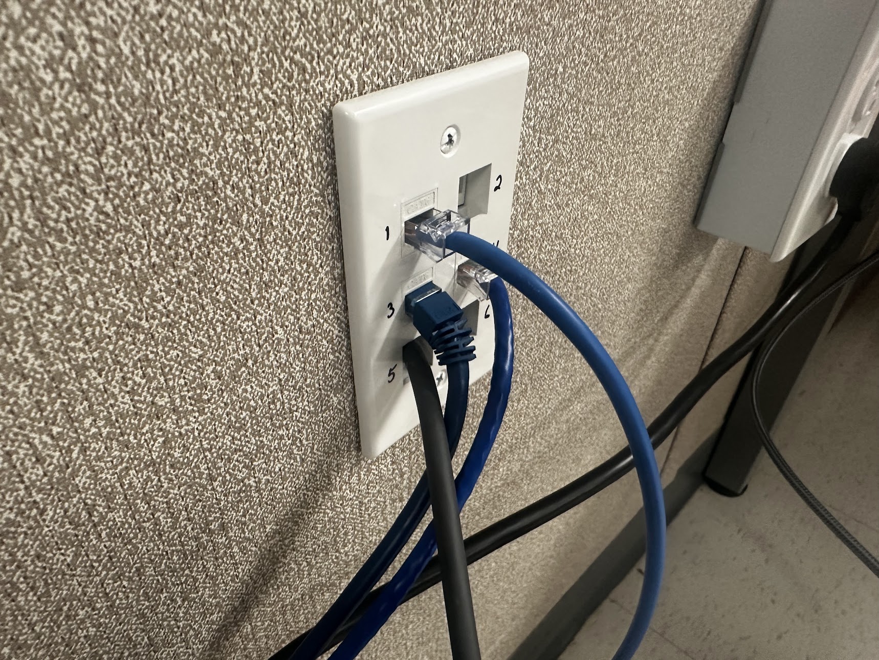 Ethernet wall-plate connections photographed by Caleb Mann during installation work