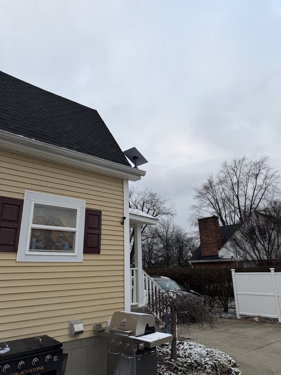 Starlink dish installed neatly at the roofline of a residential home